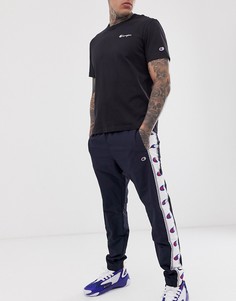 Темно-синие брюки с кантом на манжетах Champion - Темно-синий