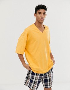 Желтая oversize-футболка ASOS DESIGN hockey