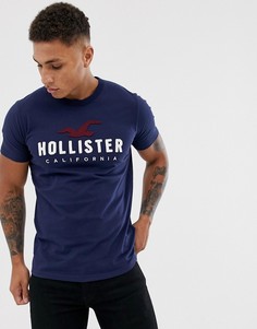 Темно-синяя футболка с аппликацией логотипа Hollister - Темно-синий