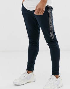 Темно-синие спортивные штаны с полосками по бокам Jack & Jones Intelligence - Темно-синий