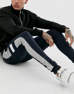 Темно-синие трикотажные джоггеры скинни со вставками ASOS DESIGN - Темно-синий