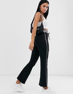 Расклешенные брюки в спортивном стиле ASOS DESIGN - Черный