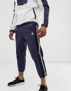 Темно-синие суженные книзу джоггеры Reebok meet you there - Темно-синий
