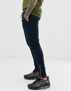 Темно-синие зауженные джоггеры с золотистыми молниями на манжетах ASOS DESIGN - Темно-синий