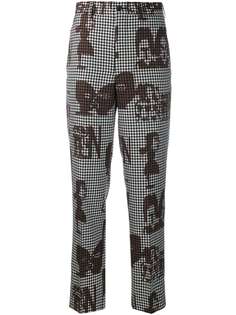 Comme Des Garçons printed faces trousers