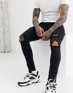 Черные супероблегающие джинсы с рваной отделкой Bershka