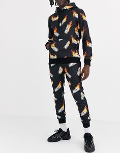 Джоггеры с принтом горящих банкнот Criminal Damage