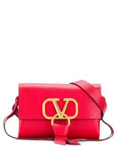 Valentino поясная сумка Valentino Garavani с декором VRing