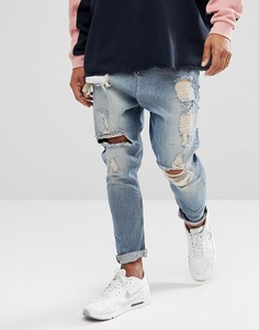 Голубые джинсы заниженного кроя с рваной отделкой ASOS DESIGN-Синий