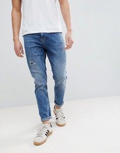 Темные суженные джинсы с рваной отделкой ASOS DESIGN-Синий