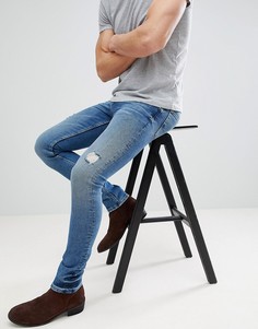 Темно-синие джинсы скинни с рваной отделкой ASOS DESIGN-Синий