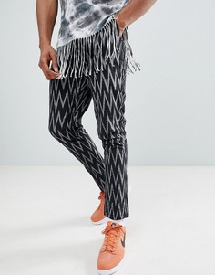Черные суженные книзу брюки с ацтекским принтом ASOS DESIGN-Черный