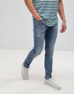 Темно-синие джинсы скинни с рваной отделкой ASOS DESIGN-Синий