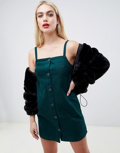 Темно-зеленое джинсовое платье с пуговицами на бретельках ASOS DESIGN-Зеленый