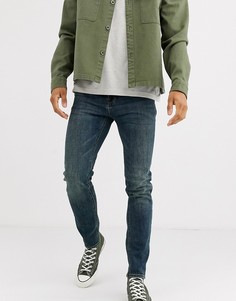 Темно-выбеленные джинсы скинни ASOS DESIGN-Синий