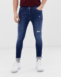 Синие эластичные джинсы с напылением и рваной отделкой ASOS DESIGN-Синий