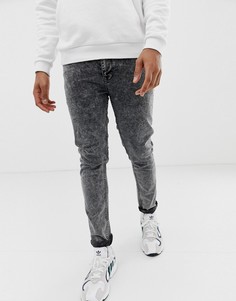 Черные джинсы скинни с эффектом кислотной стирки ASOS DESIGN-Черный