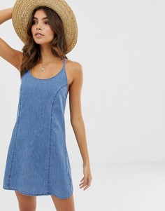 Синий выбеленный джинсовый сарафан с завязкой на спине ASOS DESIGN
