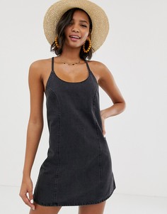 Черный джинсовый сарафан с завязкой сзади ASOS DESIGN