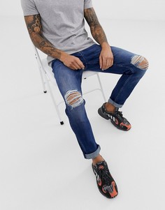 Темно-синие узкие эластичные джинсы с рваными коленями ASOS DESIGN-Синий