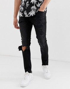 Черные выбеленные джинсы супероблегающего кроя с рваной отделкой ASOS DESIGN-Черный