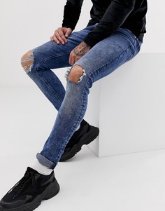 Синие джинсы скинни с эффектом кислотной стирки ASOS DESIGN-Синий