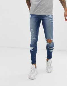 Синие выбеленные эластичные джинсы с рваной отделкой ASOS DESIGN-Синий