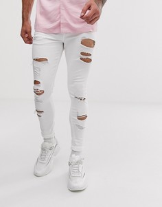 Белые эластичные джинсы с напылением и рваной отделкой ASOS DESIGN-Белый