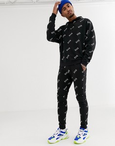 Черные джоггеры скинни от комплекта с принтом ASOS DESIGN-Черный