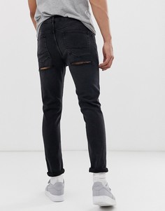 Черные выбеленные джинсы скинни с рваной отделкой ASOS DESIGN-Черный