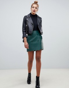 Мини-юбка из искусственной кожи с фигурной отделкой по краю ASOS DESIGN-Зеленый