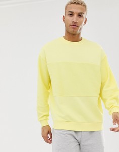 Желтый oversize-свитшот с изнаночными вставками ASOS DESIGN