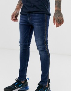 Темно-синие эластичные джинсы с напылением и молниями по бокам ASOS DESIGN-Синий