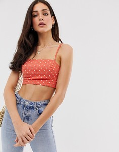 Оранжевый топ в горошек Stradivarius