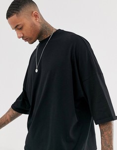 Черный oversize-лонгслив с подвернутыми манжетами ASOS DESIGN