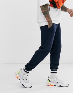 Темно-синие суженные книзу джоггеры в полоску и рубчик ASOS DESIGN-Темно-синий