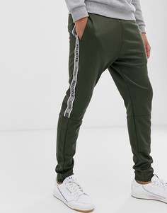Джоггеры оливкового цвета с фирменной лентой сбоку и кромкой манжетом Hollister-Серый