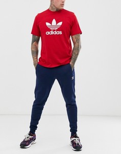 Зауженные флисовые брюки adidas-Синий