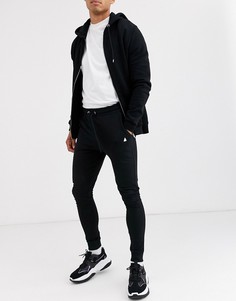 Черные легкие джоггеры супероблегающего кроя с треугольником ASOS DESIGN-Черный