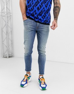Синие выбеленные укороченные джинсы скинни с необработанными краями ASOS DESIGN-Синий
