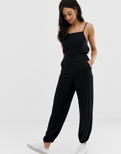 Комбинезон с бретелями на спине и эластичными манжетами ASOS DESIGN-Черный