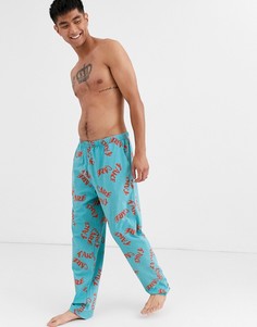 Сине-зеленые пижамные штаны с принтом \take care\" ASOS DESIGN-Мульти