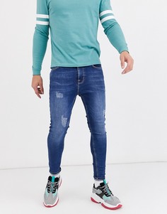 Темно-синие джинсы с напылением и потертостями ASOS DESIGN-Синий