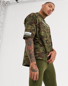 Камуфляжная oversize-футболка с принтом на груди и рукаве ASOS DESIGN-Зеленый