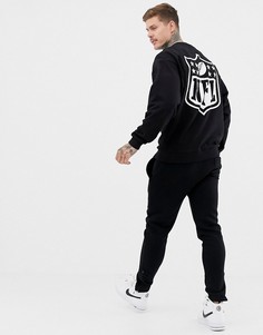 Черный oversize-свитшот с вышивкой и принтом NFL на спине ASOS DESIGN