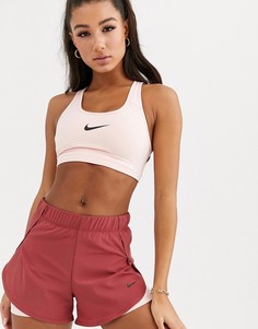 Розовый бюстгальтер со средней степенью поддержки Nike Training