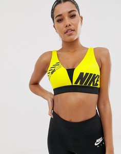 Желтый бюстгальтер с глубоким вырезом Nike Training