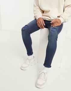 Синие эластичные джинсы с напылением и рваной отделкой ASOS DESIGN-Синий