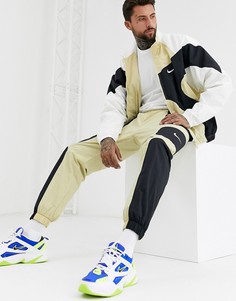 Золотистые джоггеры с манжетами Nike Re-Issues-Золотой