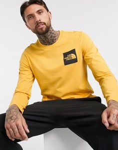 Желтый лонгслив The North Face